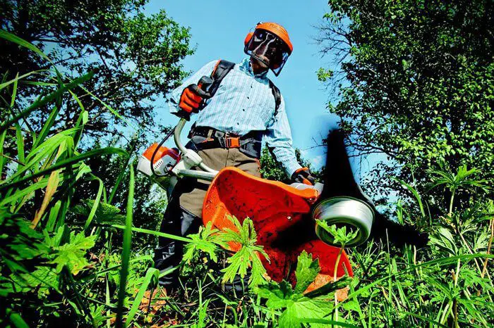 Using a brush cutter to maintain a garden